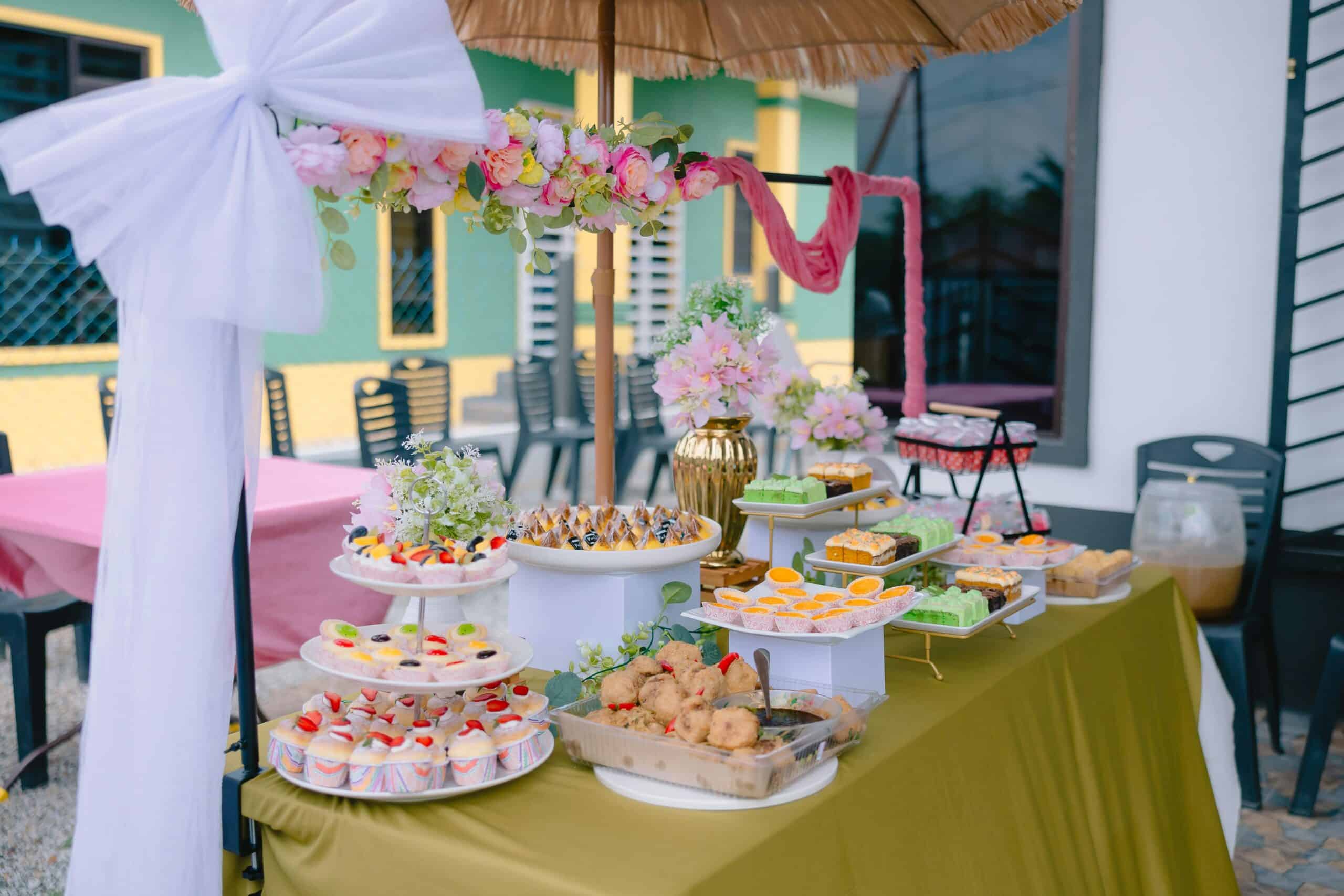 Event dessert table with cakes, pastries and decorative setup