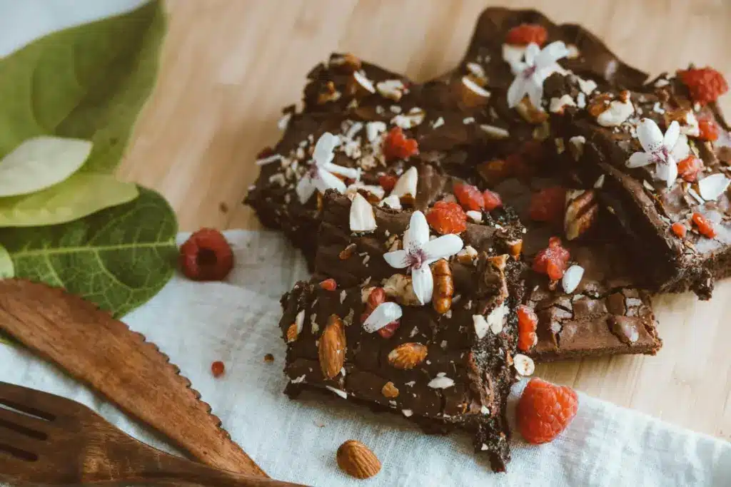 Chocolate brownie pieces with nuts and coconut flakes